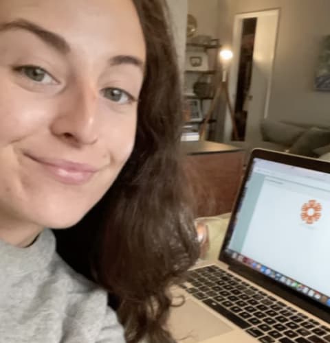 Volunteer taking a selfie with their laptop.