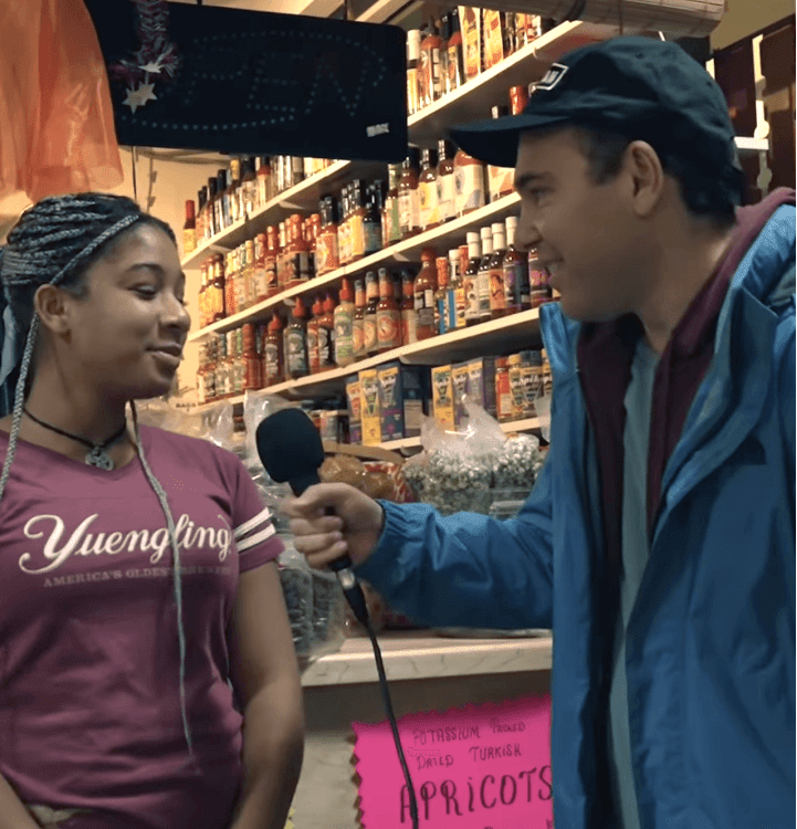 Jon Lovett interviewing a young voter.