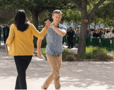 Crooked Media's Tommy Vietor high-fiving City Councilwoman Arlis Reynolds at an event in Irvine.